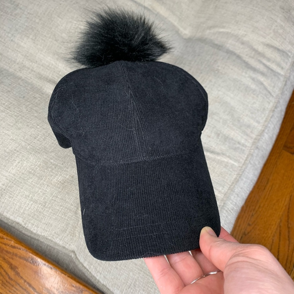 Brand new black hat with puff